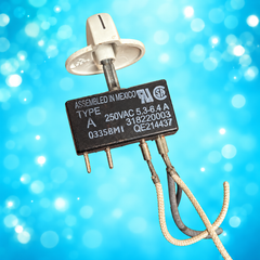 Used Frigidaire 318220003 surface element switch and cream knob on aqua background