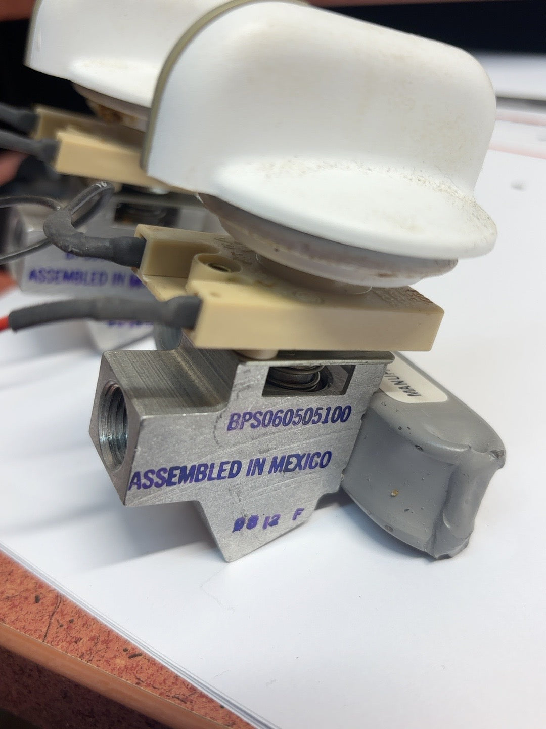 Other-side KitchenAid valve assembly close-up, stamp BPS060505100