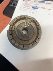 Used medium gas stove burner head, top view; cap not included