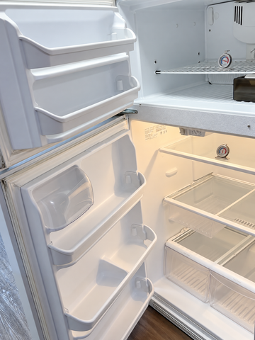 Frigidaire refrigerator interior — surface dirt digitally removed