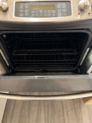 GE gas stove oven interior with racks