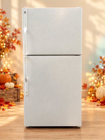 Used white GE 32-inch top-freezer refrigerator on Thanksgiving background