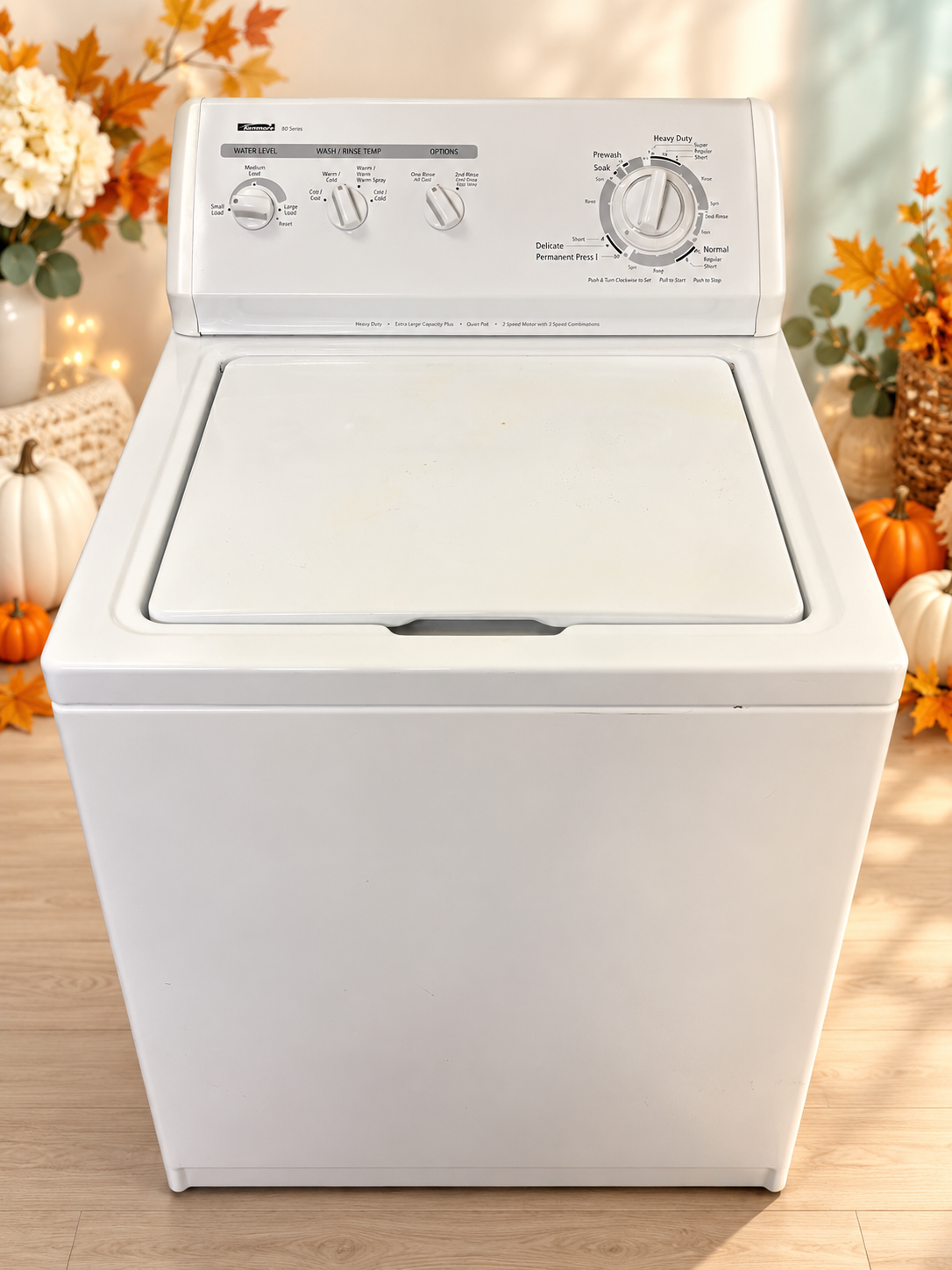 Used white Kenmore 24-inch top-load washer with light Thanksgiving background