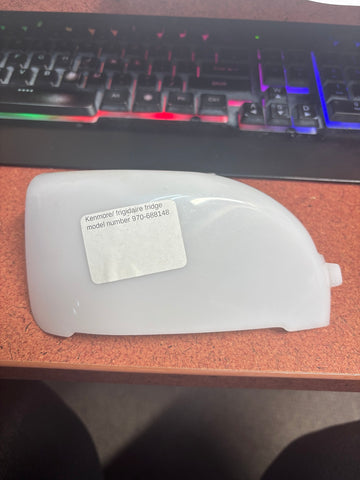 Exterior of refrigerator light cover with donor model label