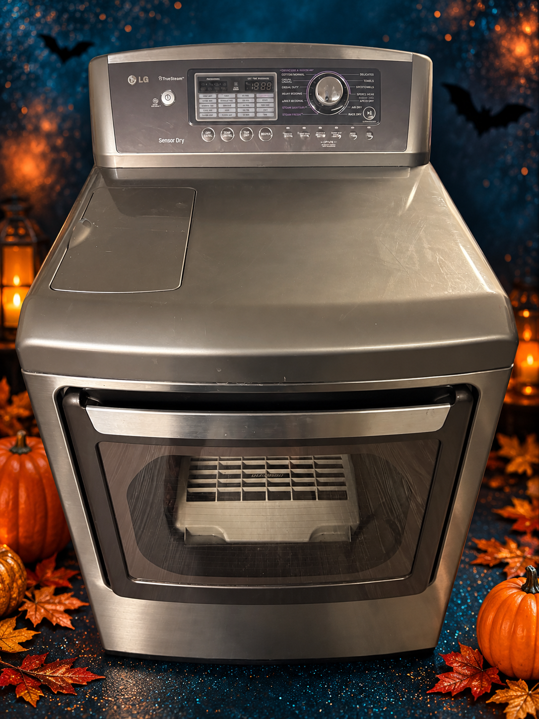 Used graphite grey LG TrueSteam dryer on a Halloween background
